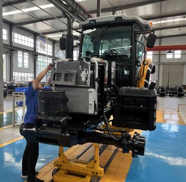 a man standing in a factory with a machine