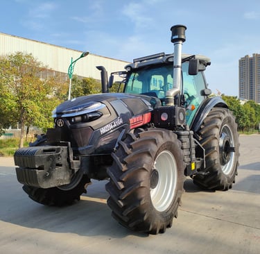 a tractor with a large tire on the side of the road