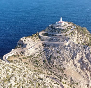 Aerial view of Cap de Formentor lighthouse in Mallorca with dramatic cliffs overlooking the Mediterr