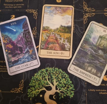 3 tarot cards the star, the sun, the empress