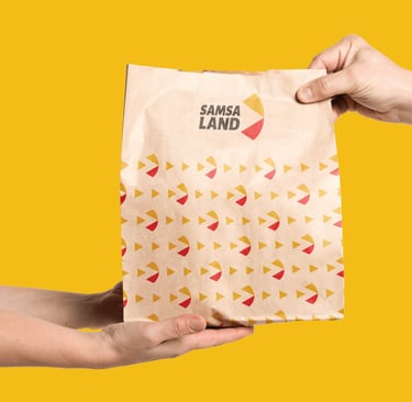 a person holding a bag of food in a bag