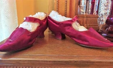Salem, OR - Red pointy satin shoes worn by women in the early days of the Deepwood Manion 