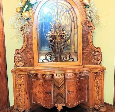 Portland, OR - An intricately carved wooden cabinet at the Victorian Belle