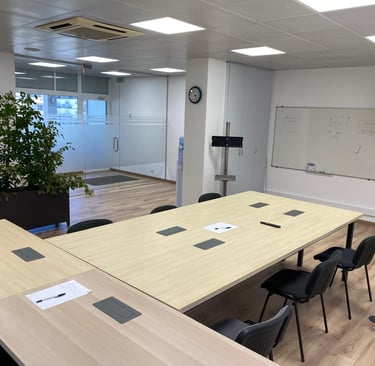 a conference room with a large table and chairs