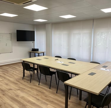 a conference room with a table and chairs
