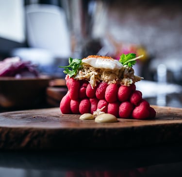a pile of radishes on a cutting board