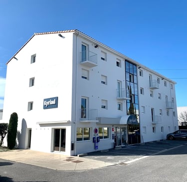 a building with a parking lot and a parking lot