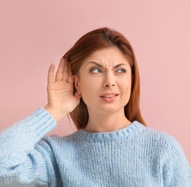 woman with blue jumper with hearing problems