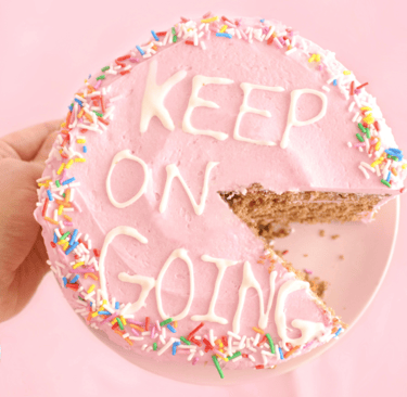 image of a cake that says KEEP ON GOING