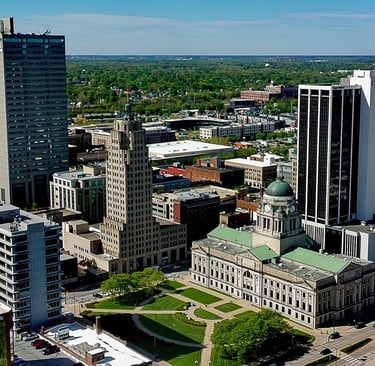 Aerial view of downtown Fort Wayne skyline featuring the Allen County Courthouse and historic skyscrapers.