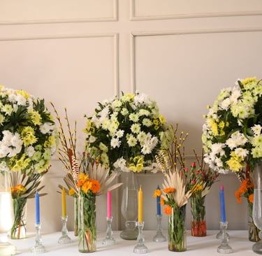 a row of vases with flowers in them