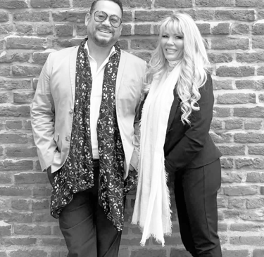 a man and woman standing next to each other