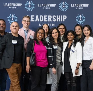 Francisco standing with classmates from Leadership Austin