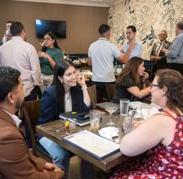 Jenny Silva chats with classmates at Hispanic Austin Leadership event