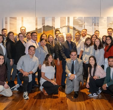 Francisco poses proudly with Hispanic Austin Leadership classmates, gathered for a group photo.