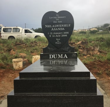 Baby grave, heart headstone with double kerbs and slab, polished all round