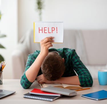Teenager holding up a Help sign