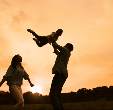 Parents playing with a child