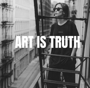 Black-and-white photo of a model on a fire escape wearing a NOVIP tee  ‘ART IS TRUTH'.