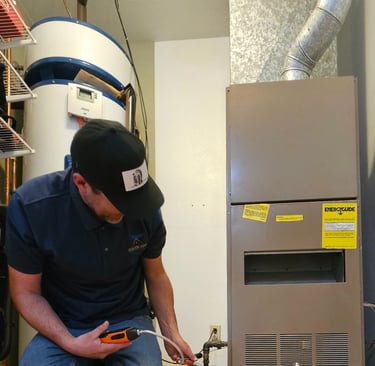 Felix checking for gas leaks on an older furnace