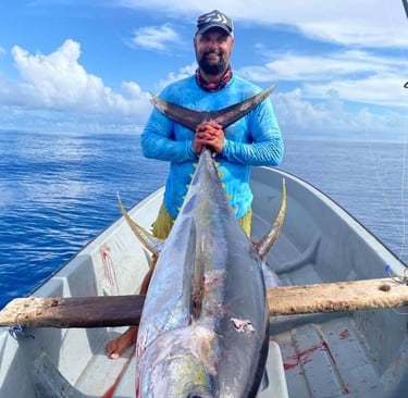 Angler proudly displaying a Yellowfin Tuna caught on a Full-Day Fishing Charter in Zanzibar