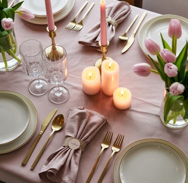 a table setting with candles and candles