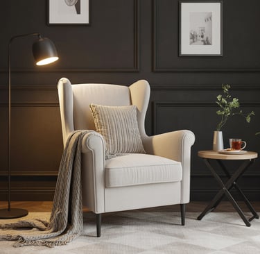 a chair with a blanket on it and a lamp on the side of a table