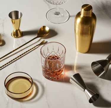 a barbequette with a cocktail glass and a cocktail glass