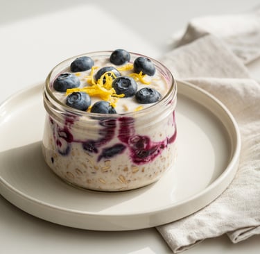 a glass jar of oatmeal with blueberries and lemons