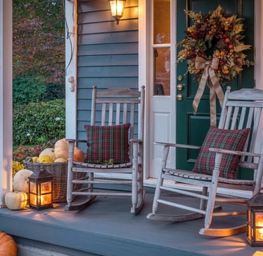 a rocking chair with pumpkins and pumpkins