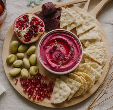a plate of food with crackers and fruit