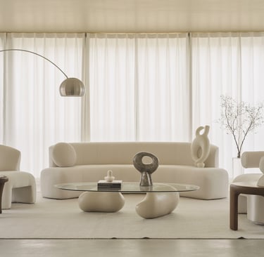 a living room with a couch and chairs