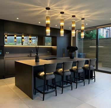 Dark graphite porcelain kitchen island with waterfall edge worktop 