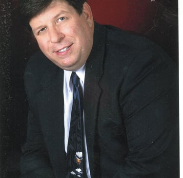 a man in a suit and tie with a tie