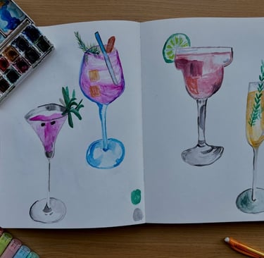 a book opened to show a drawing of a cocktail