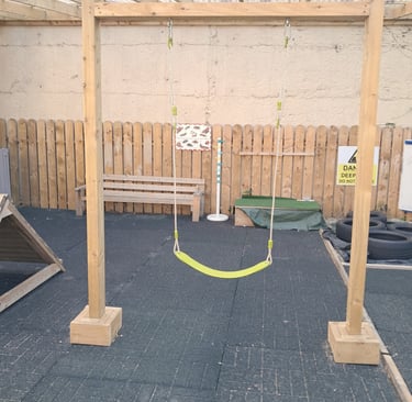 Swing inside Montessori playmates playground