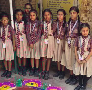 VBSS students celebrating Diwali with colorful Rangolis.