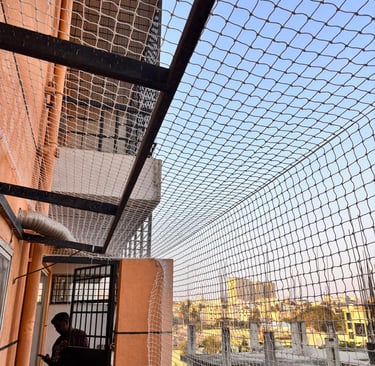 Duct area covered with a custom-cut pigeon net, preventing bird entry while allowing airflow