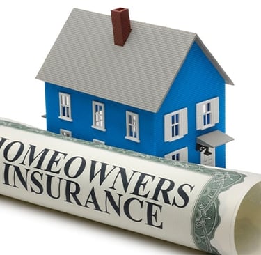 large homeowners policy paper next to a small model home