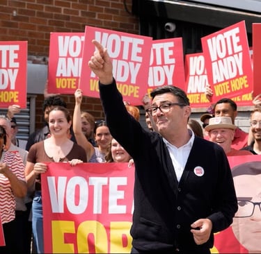 Andy Burnham with his supports during the recent by-election in Manchester
