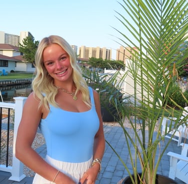 Whitney standing confidently, symbolizing her marketing career journey and personal brand.