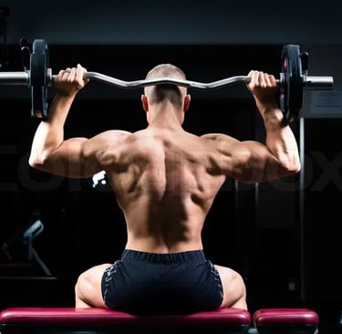 a man doing a back - up on a bench with a barbell