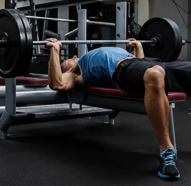a man is doing a bench press exercise