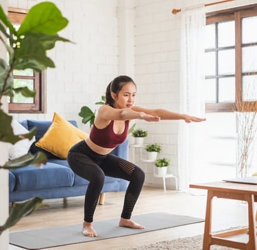 a woman doing yoga exercises on a yoga mat