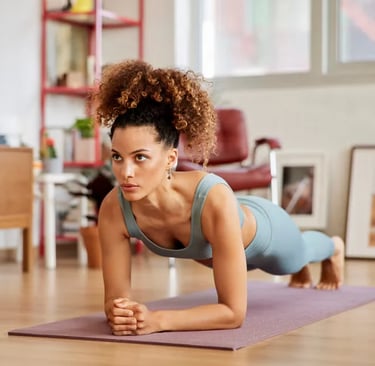a woman doing push ups on a yoga mat
