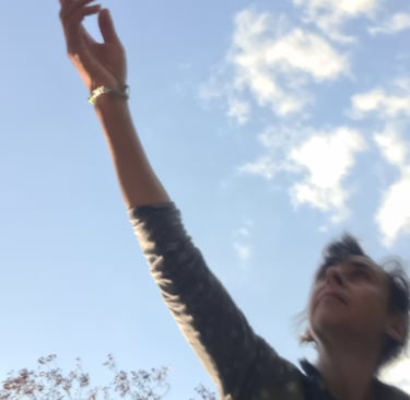 a woman reaching up