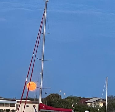 SV Unladen Swallow on anchor under a full moon on the island of Curacou - Fall 2023