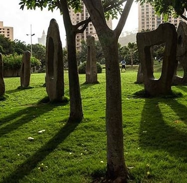 a group of people walking around a park