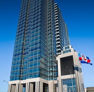a tall building with a flag flying in the sky