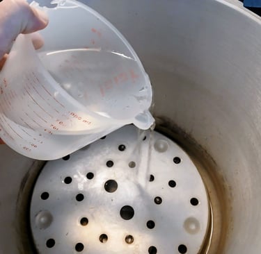 adding water to a pressure cooker